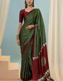 Cynosure Dark Green Ajrakh Printed Semi Modal Silk Saree With Scintilla Blouse Piece