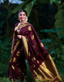 Unique Wine Soft Banarasi Silk Saree With Gratifying Blouse Piece