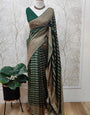 Symmetrical Dark Green Soft Banarasi Silk Saree With Staring Blouse Piece