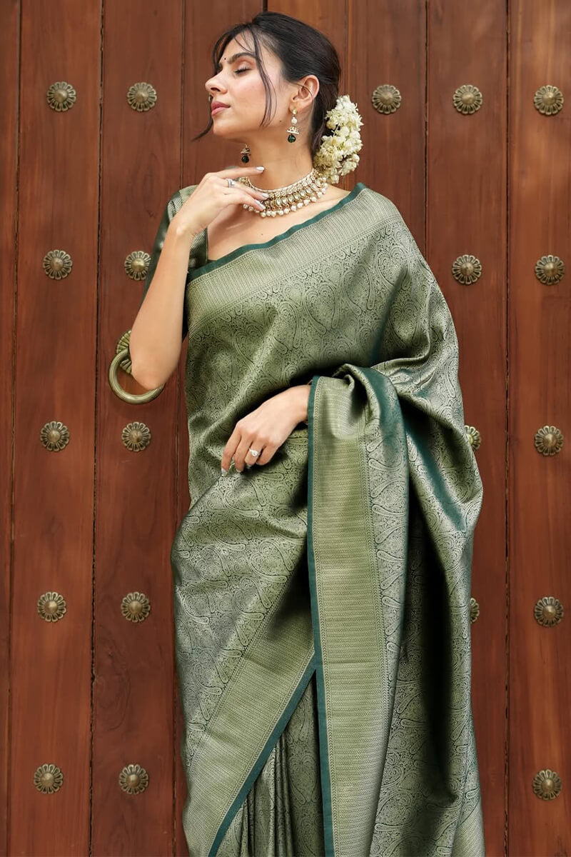 Ineffable Dark Green Soft Silk Saree With Pretty Blouse Piece