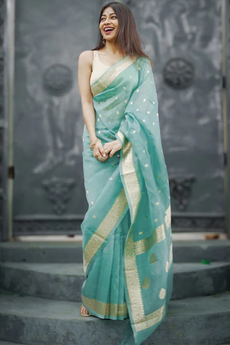 Pulsating Turquoise Linen Silk Saree With Charismatic Blouse Piece