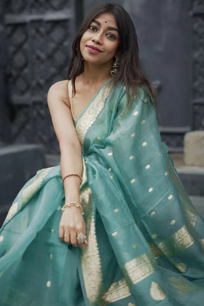 Pulsating Turquoise Linen Silk Saree With Charismatic Blouse Piece