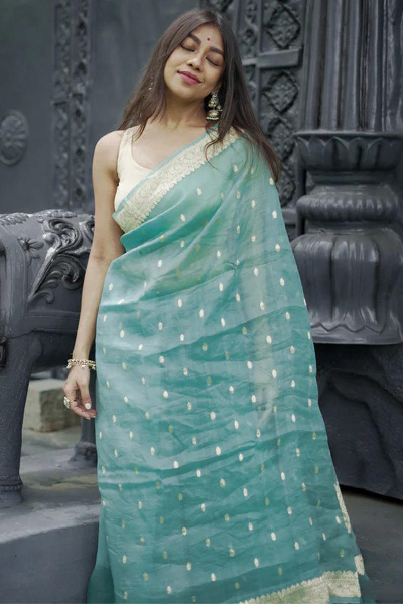 Pulsating Turquoise Linen Silk Saree With Charismatic Blouse Piece