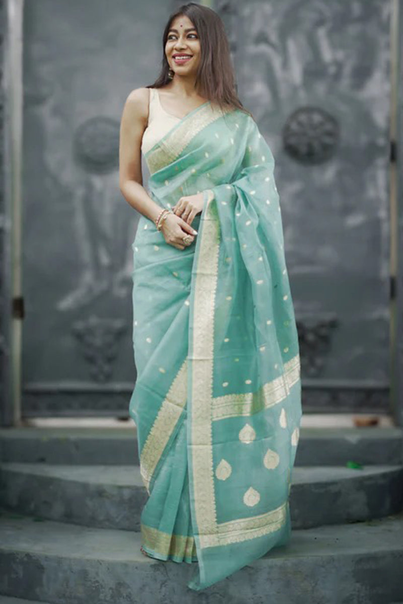 Pulsating Turquoise Linen Silk Saree With Charismatic Blouse Piece