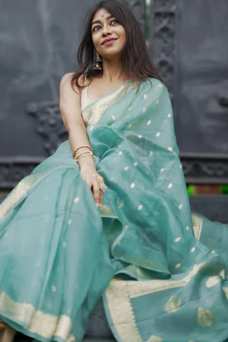 Pulsating Turquoise Linen Silk Saree With Charismatic Blouse Piece