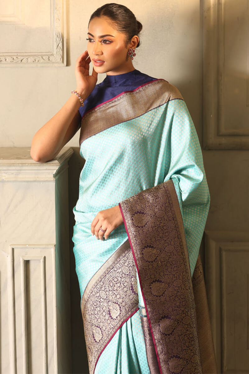 Intricate Firozi Soft Silk Saree With Majestic Blouse Piece