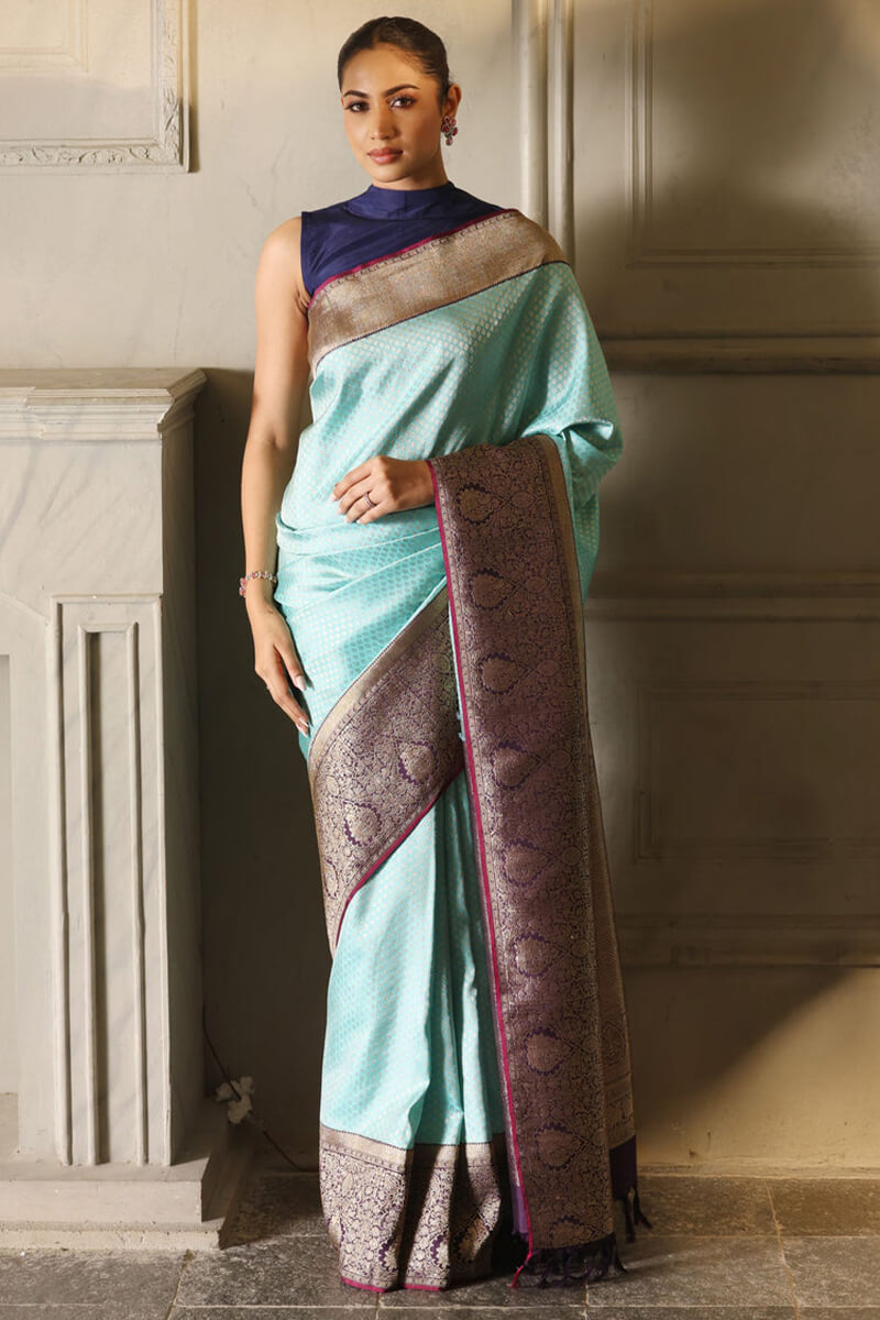 Intricate Firozi Soft Silk Saree With Majestic Blouse Piece