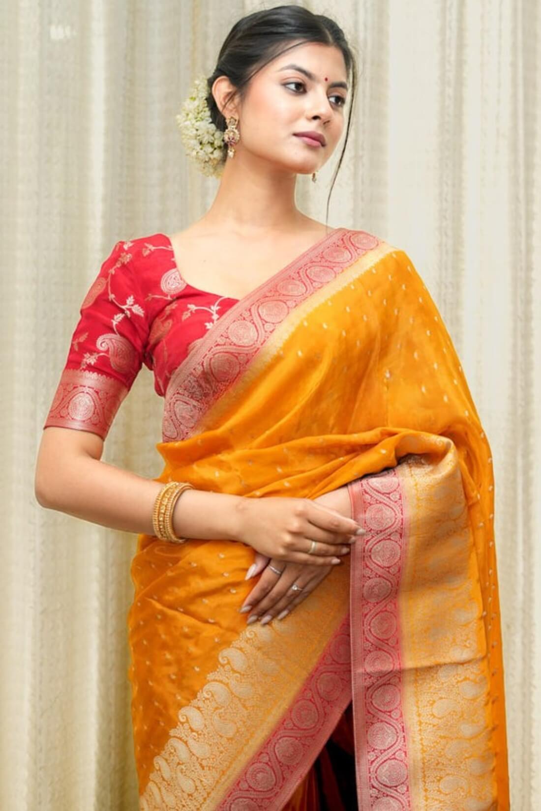 Most Flattering Orange Soft Silk Saree With Mesmerising Blouse Piece