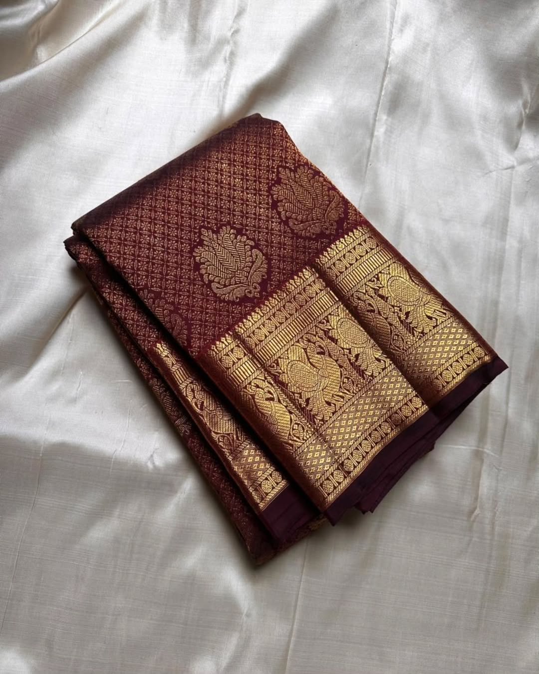 Surreptitious Wine Soft Banarasi Silk Saree With Rhapsody Blouse Piece