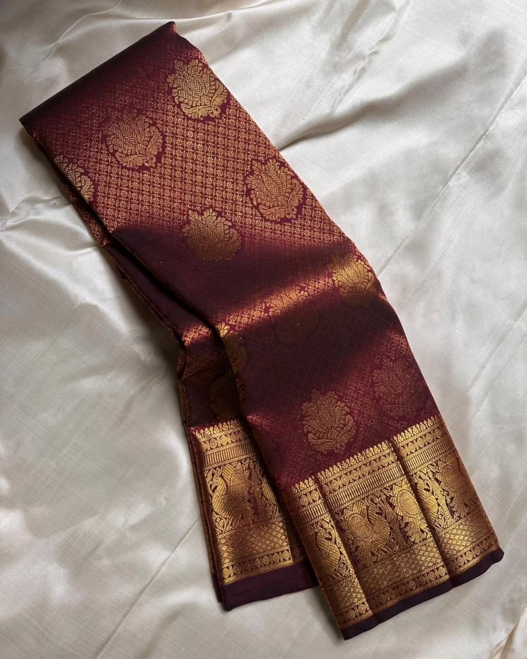 Surreptitious Wine Soft Banarasi Silk Saree With Rhapsody Blouse Piece