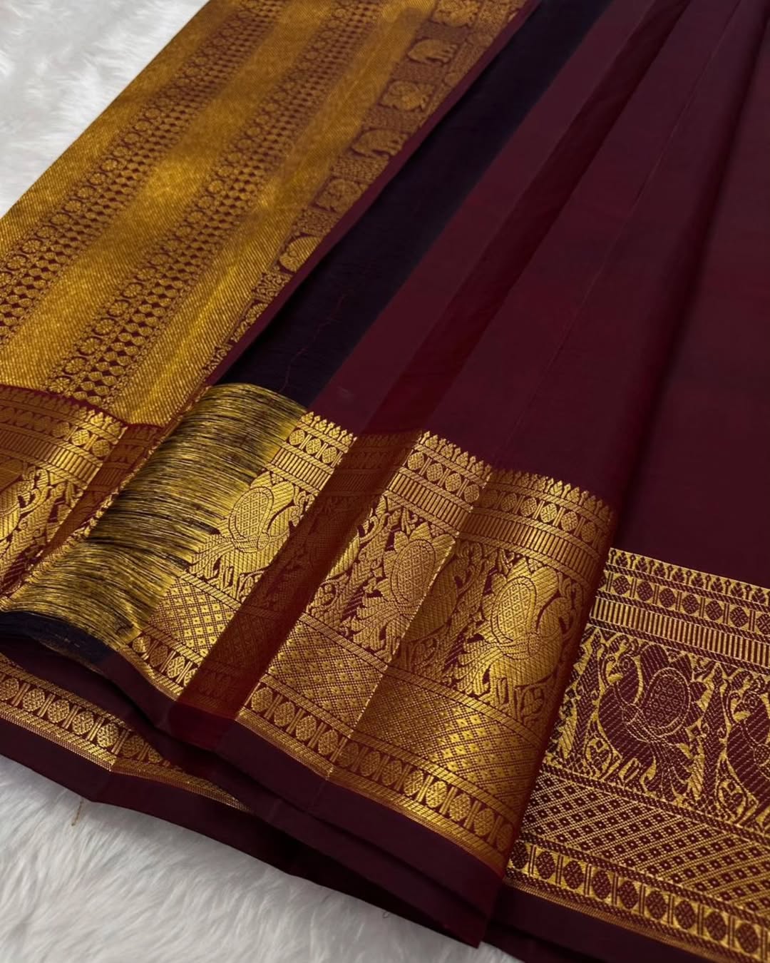 Surreptitious Wine Soft Banarasi Silk Saree With Rhapsody Blouse Piece