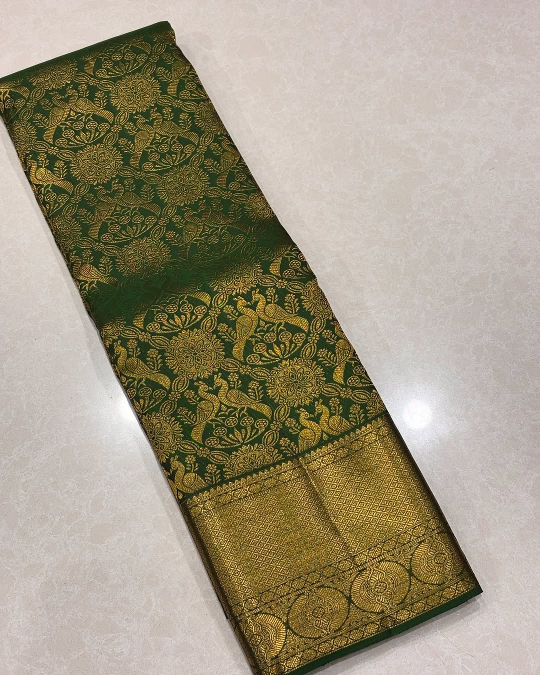 Ebullience Dark Green Soft Banarasi Silk Saree With Entrancing Blouse Piece
