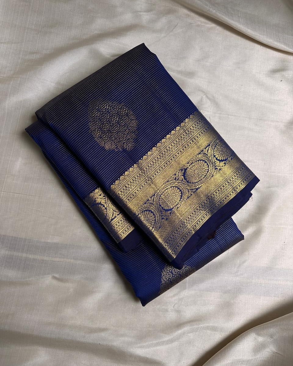 Adorning Navy Blue Soft Banarasi Silk Saree With Resplendent Blouse Piece