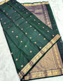 Pretty Dark Green Soft Silk Saree With Hypnotic Blouse Piece