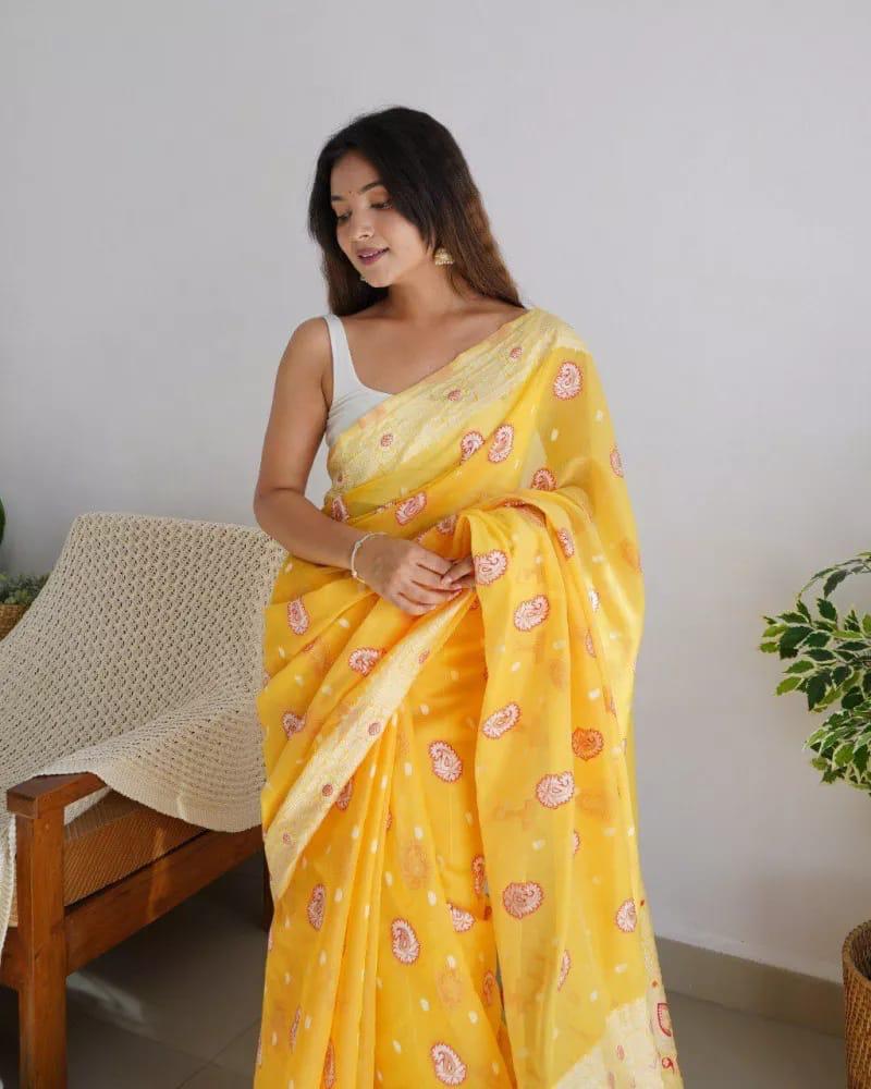 Prominent Yellow Cotton Silk Saree With Gleaming Blouse Piece