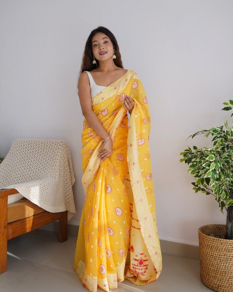 Prominent Yellow Cotton Silk Saree With Gleaming Blouse Piece