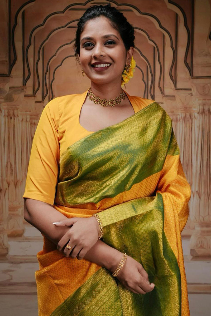 Glowing Yellow Soft Silk Saree With Engrossing Blouse Piece