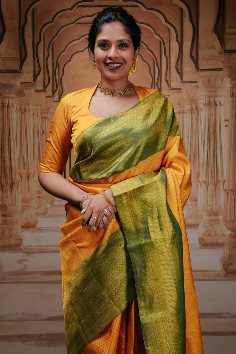 Glowing Yellow Soft Silk Saree With Engrossing Blouse Piece