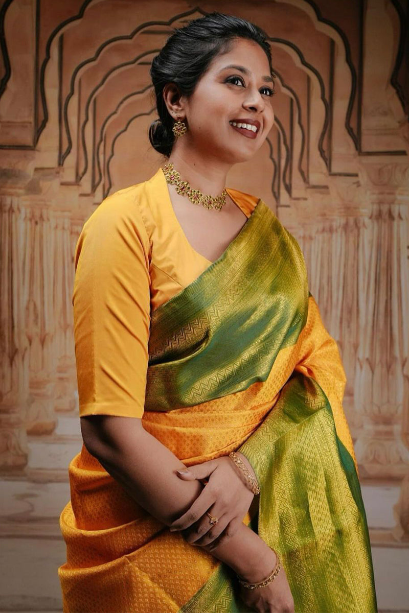 Glowing Yellow Soft Silk Saree With Engrossing Blouse Piece