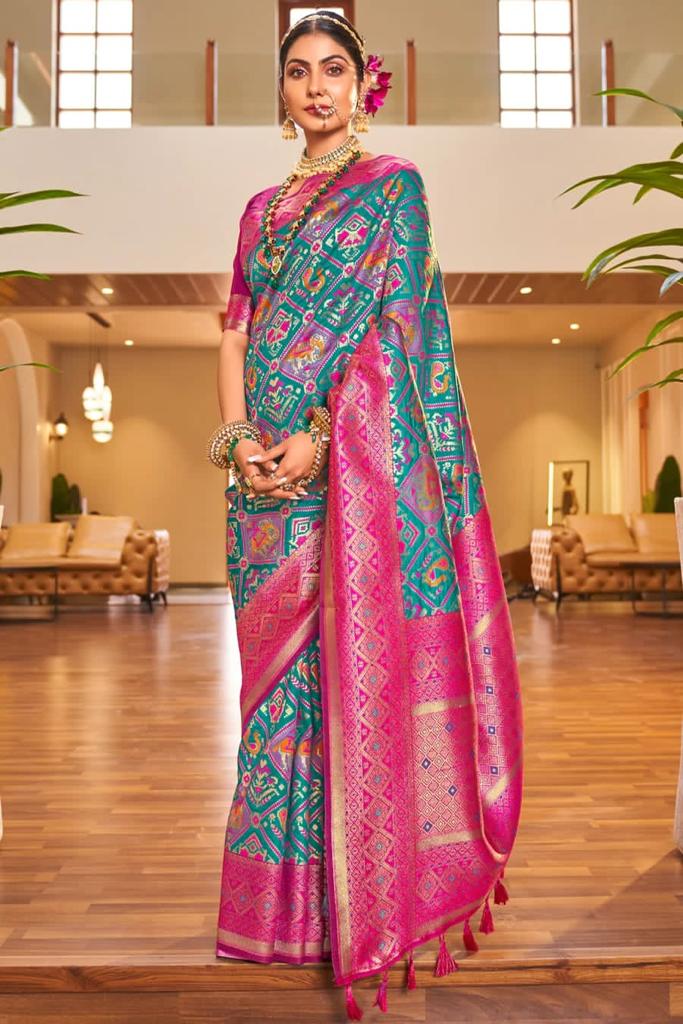 Sensational Turquoise Patola Silk Saree with Felicitous Blouse Piece