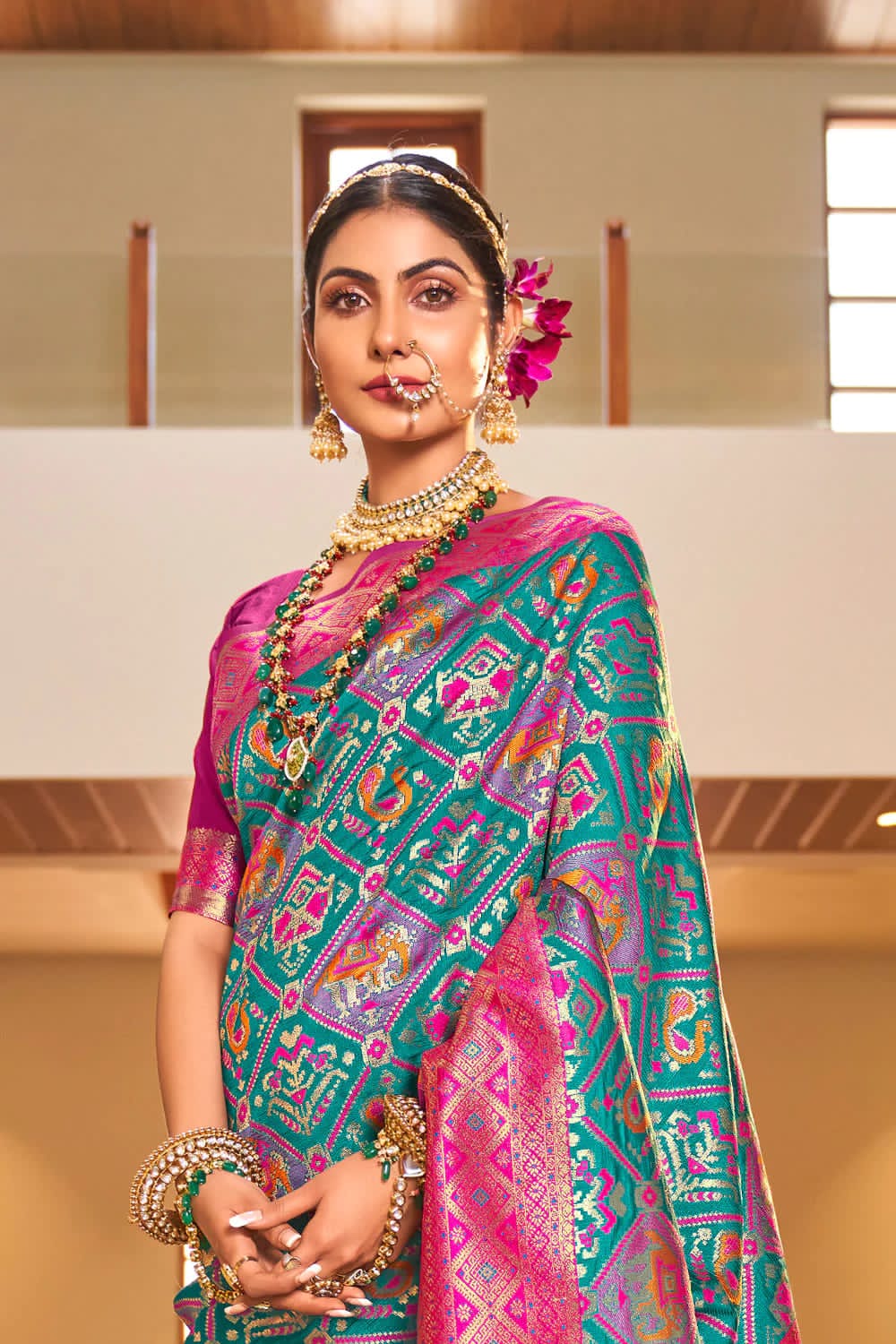 Sensational Turquoise Patola Silk Saree with Felicitous Blouse Piece