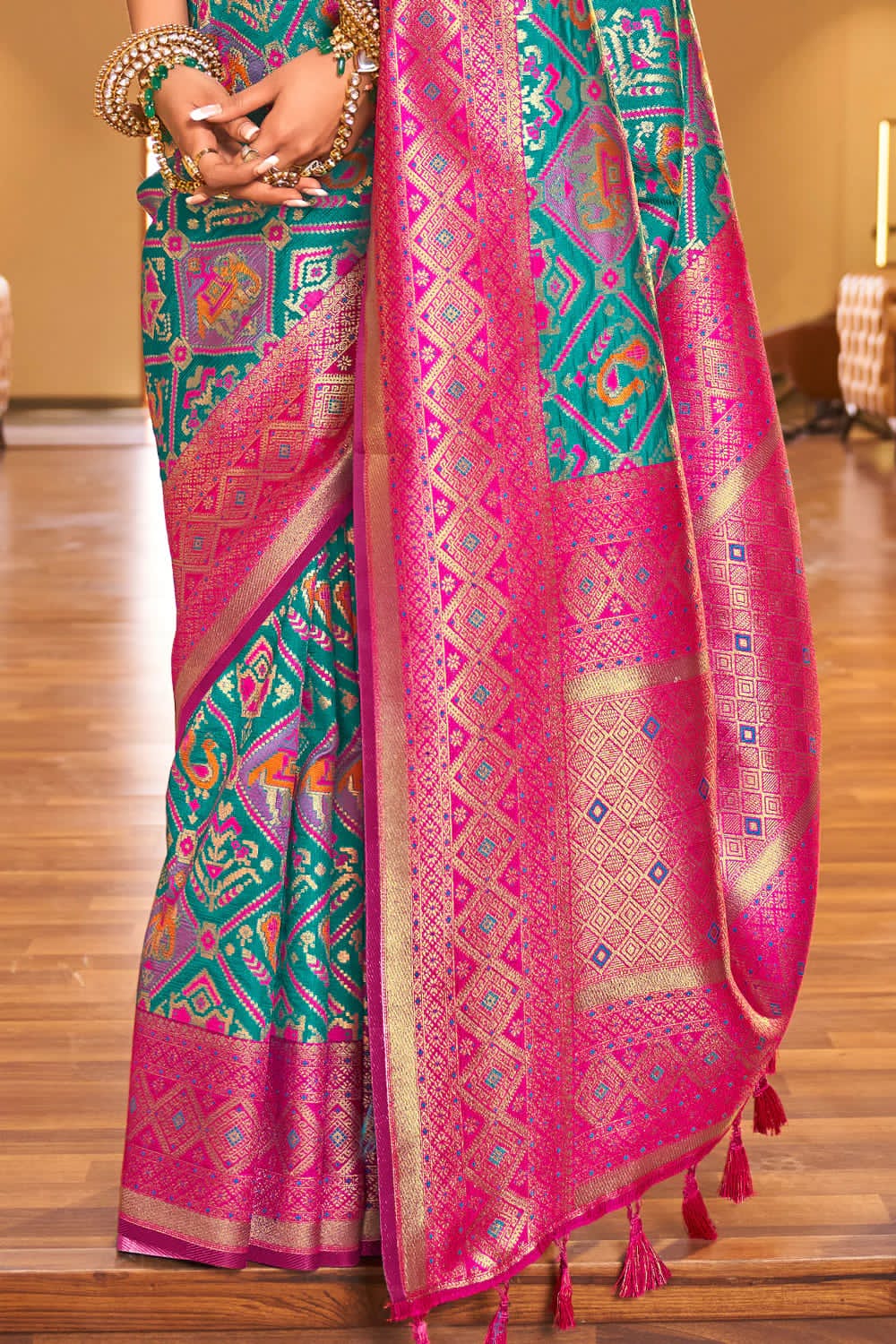 Sensational Turquoise Patola Silk Saree with Felicitous Blouse Piece