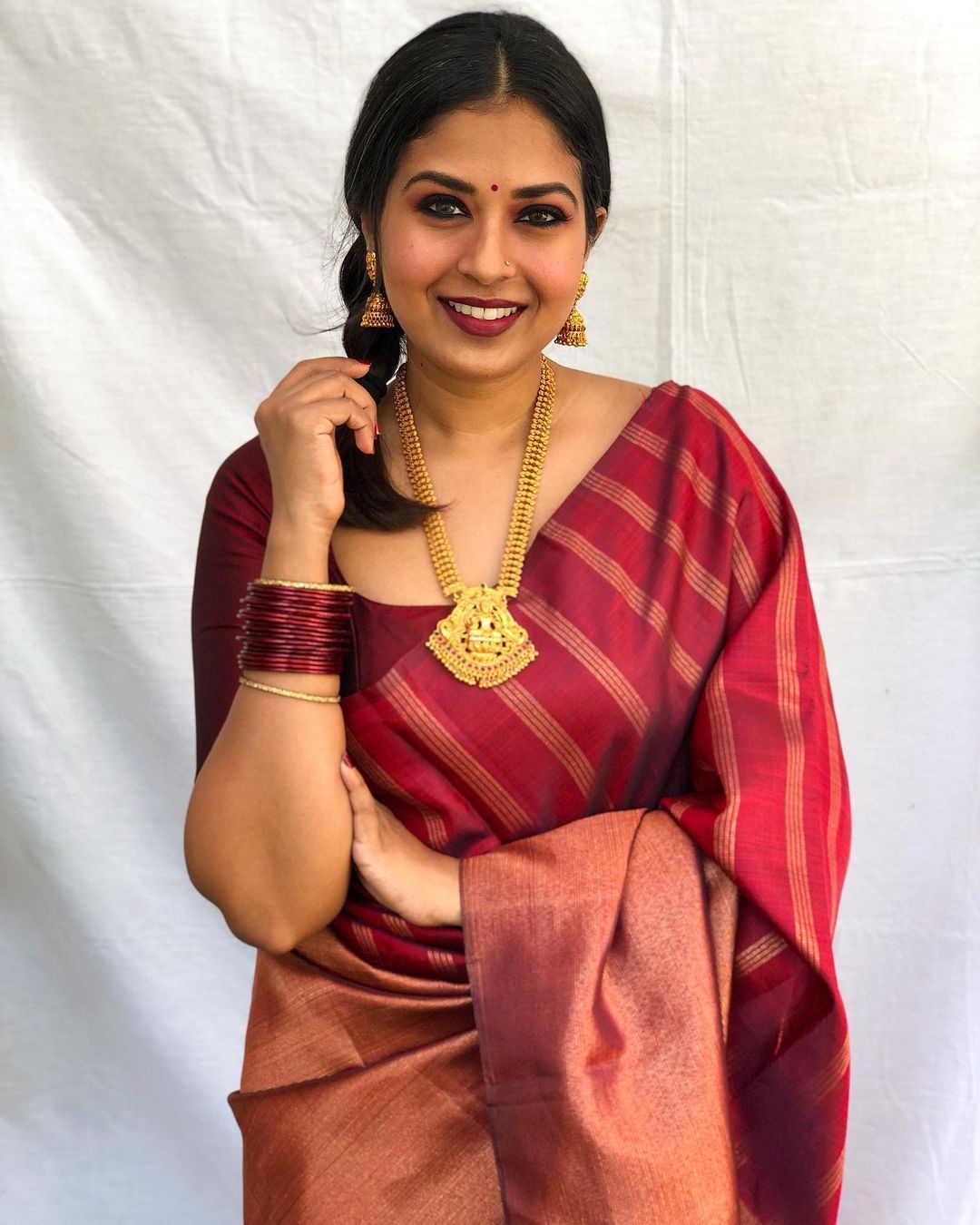 Aplomb Maroon Soft Banarasi Silk Saree With Prominent Blouse Piece