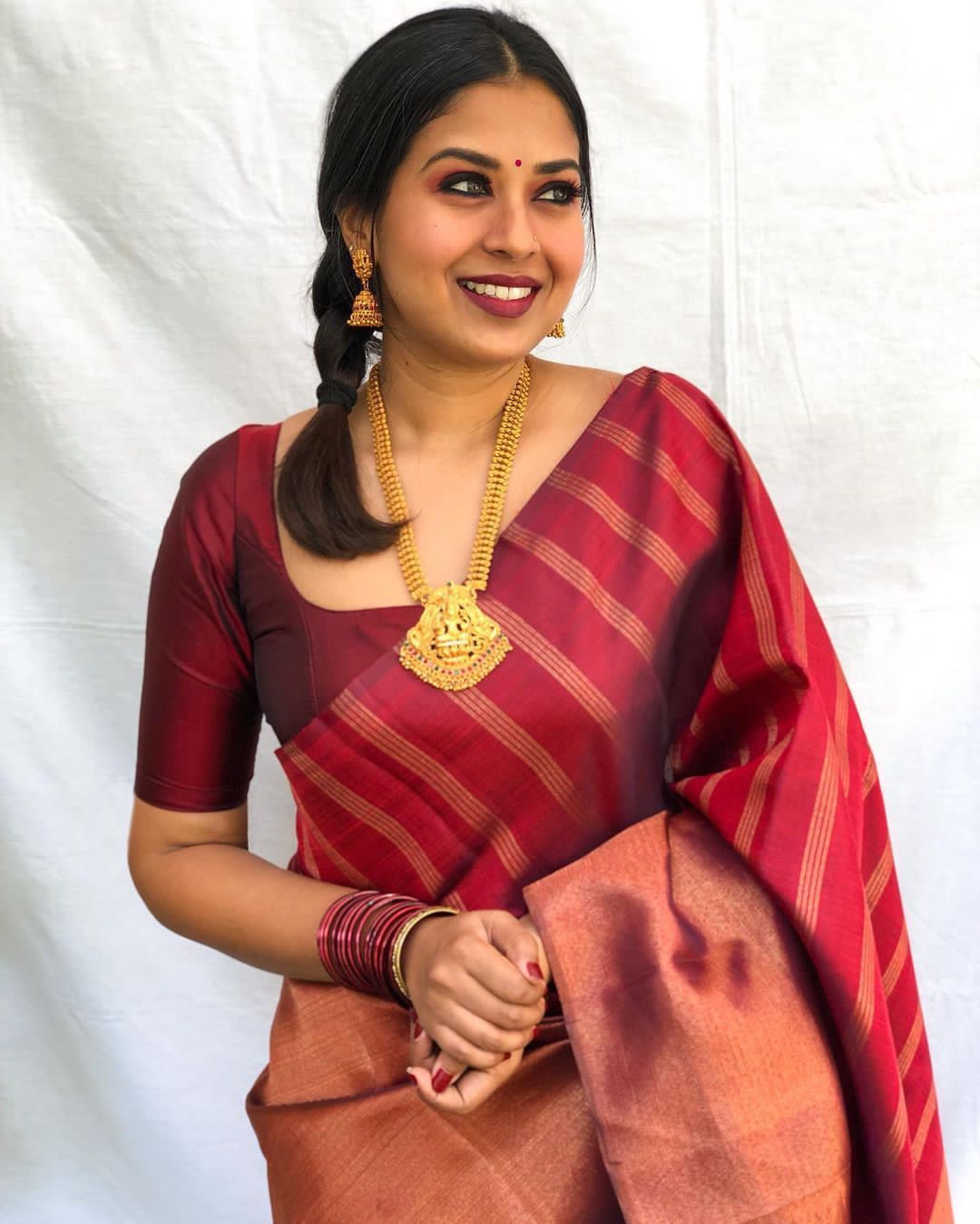 Aplomb Maroon Soft Banarasi Silk Saree With Prominent Blouse Piece