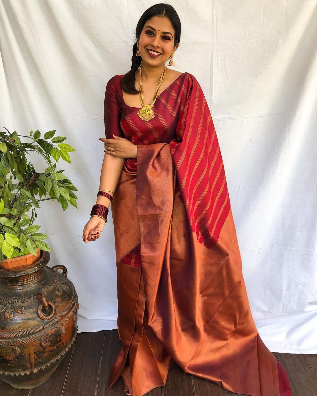 Aplomb Maroon Soft Banarasi Silk Saree With Prominent Blouse Piece