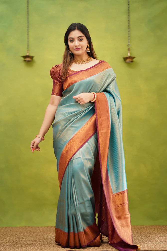 Splendorous Firozi Soft Banarasi Silk Saree With Ephemeral Blouse Piece