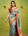 Splendorous Firozi Soft Banarasi Silk Saree With Ephemeral Blouse Piece