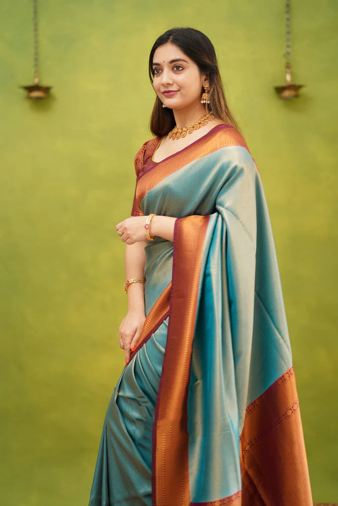 Splendorous Firozi Soft Banarasi Silk Saree With Ephemeral Blouse Piece