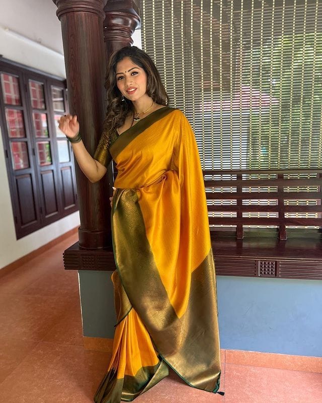 Rhapsodic Yellow Soft Silk Saree with Lissome Blouse Piece