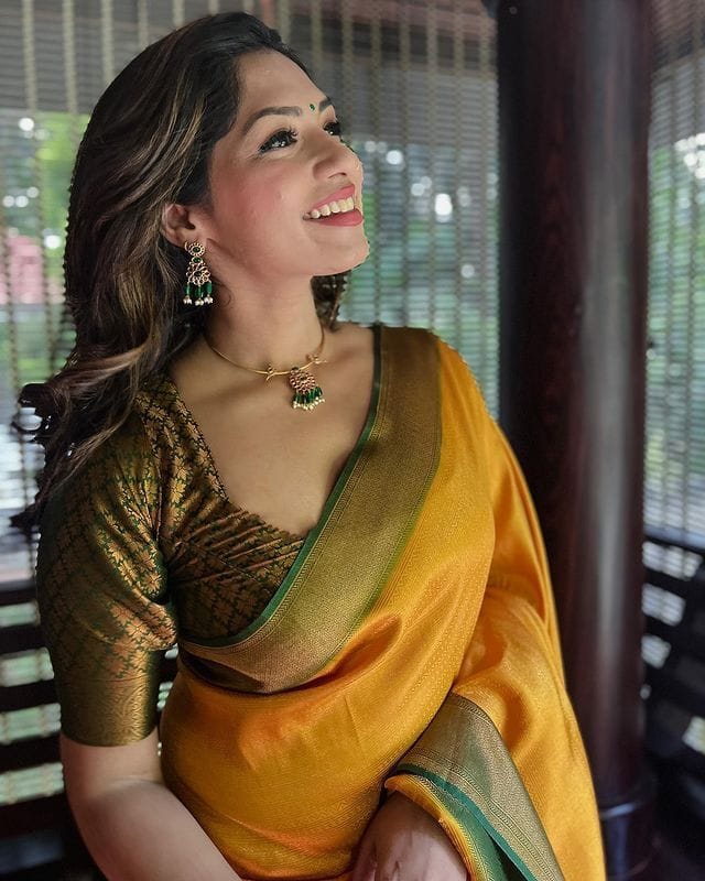 Rhapsodic Yellow Soft Silk Saree with Lissome Blouse Piece