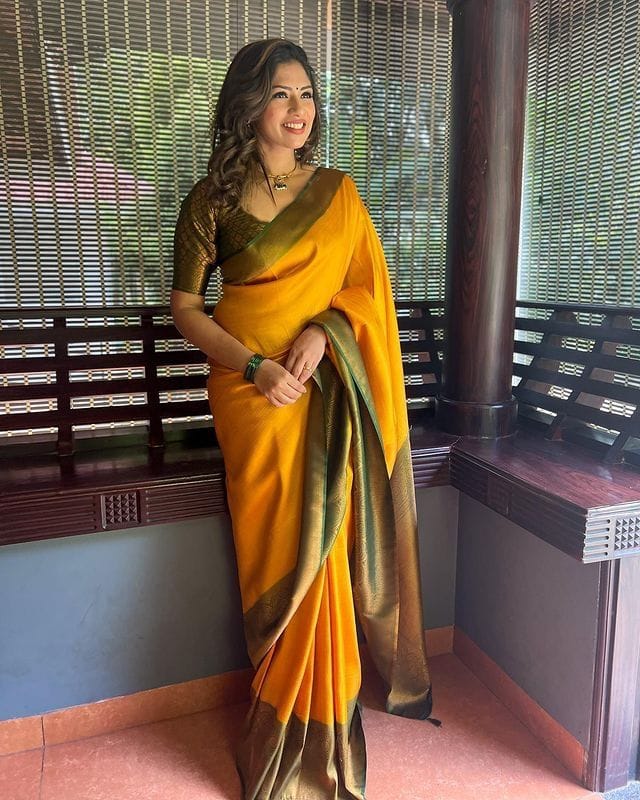 Rhapsodic Yellow Soft Silk Saree with Lissome Blouse Piece