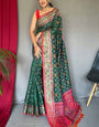 Glamorous Dark Green Patola Silk Saree with Ineffable Blouse Piece