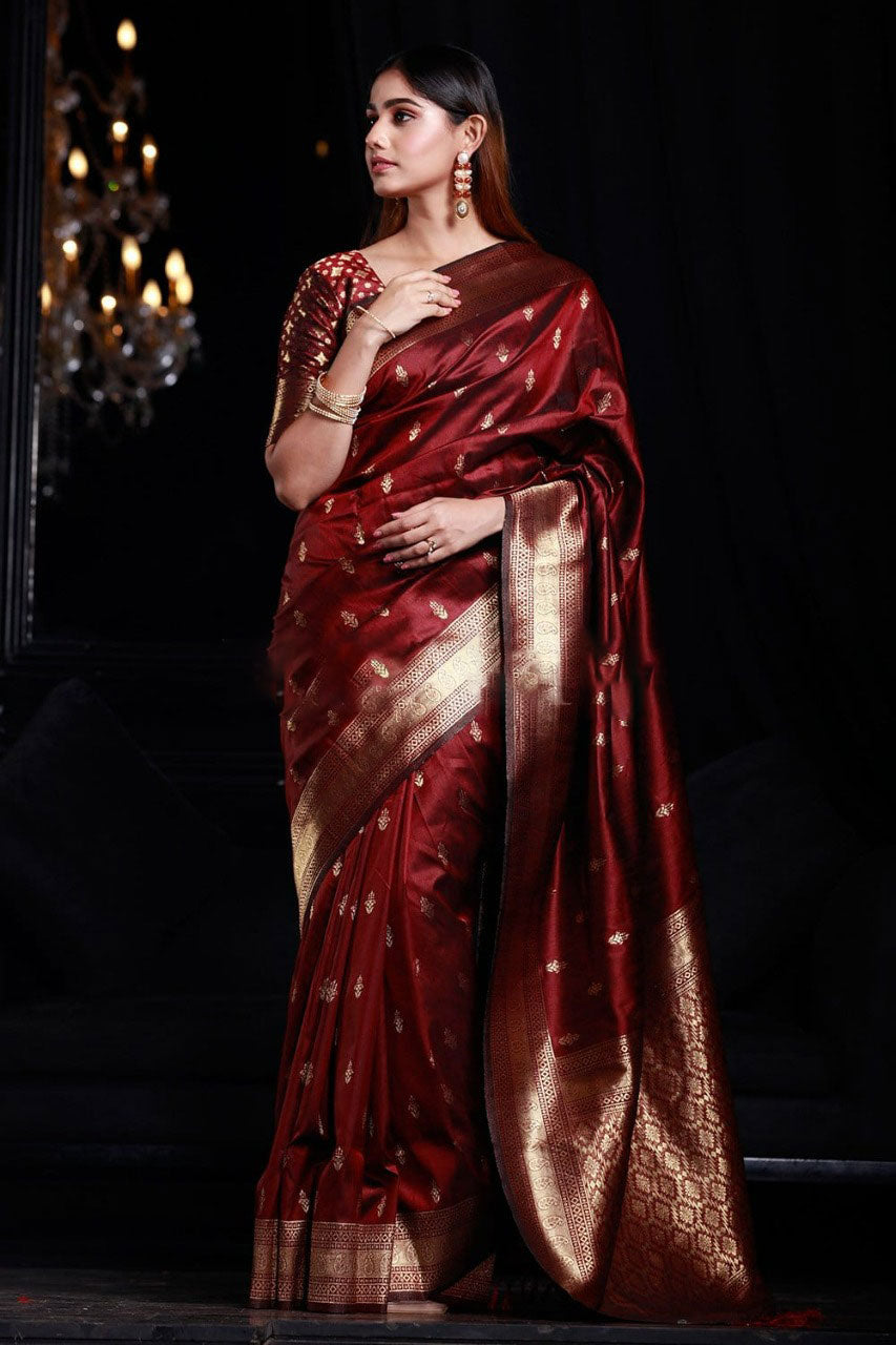 Intricate Maroon Banarasi Silk Saree With Smashing Blouse Piece