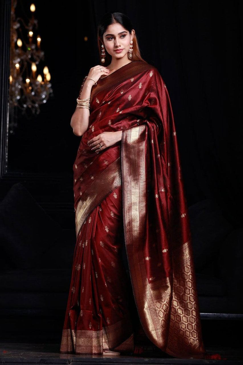 Intricate Maroon Banarasi Silk Saree With Smashing Blouse Piece