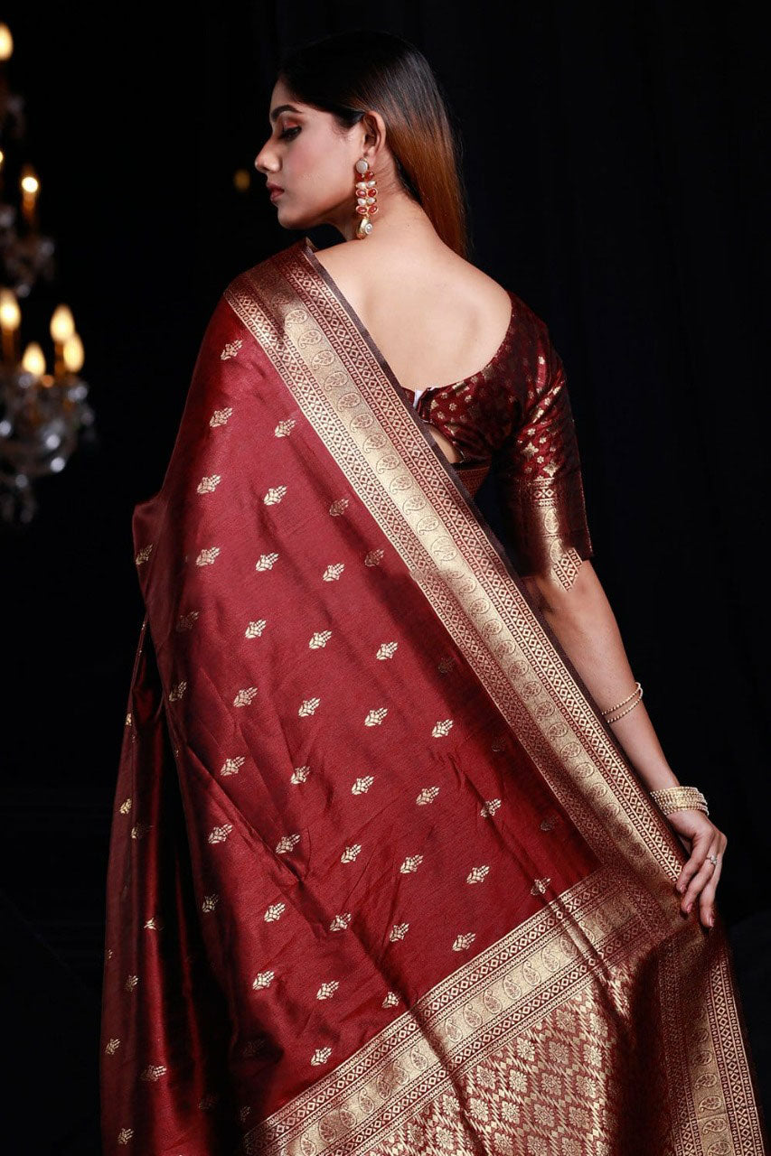 Intricate Maroon Banarasi Silk Saree With Smashing Blouse Piece