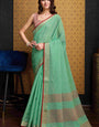 Mesmerising Sea Green Cotton Silk Saree With Groovy Blouse Piece