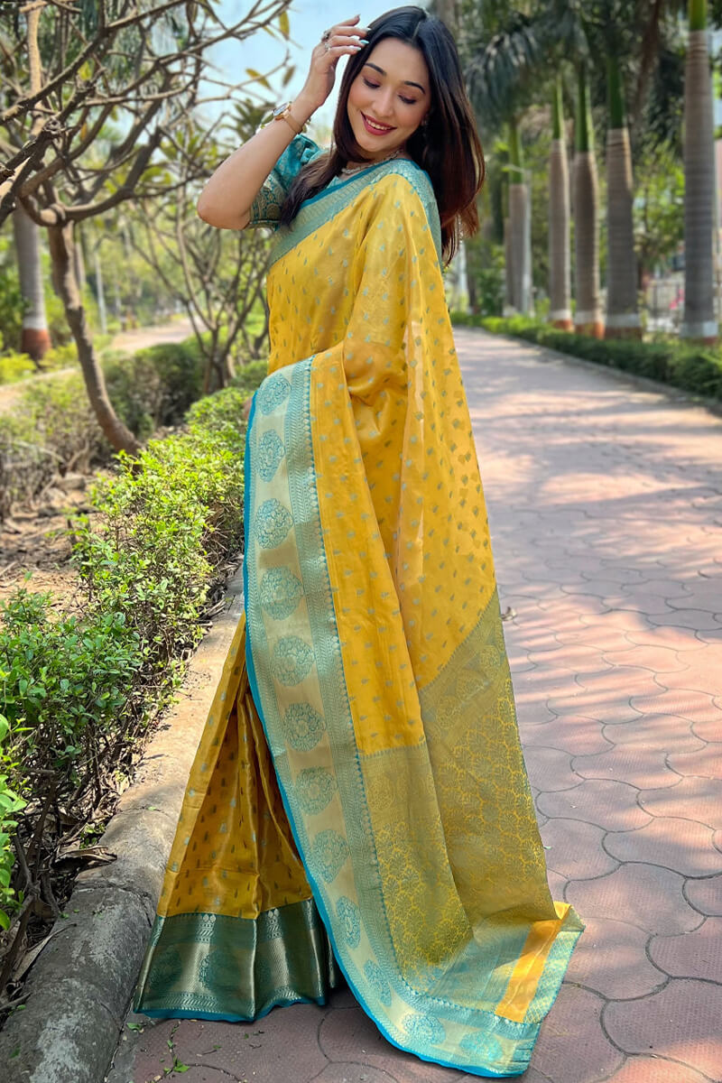 Petrichor Yellow Soft Banarasi Tissue Silk Saree With Redolent Blouse Piece