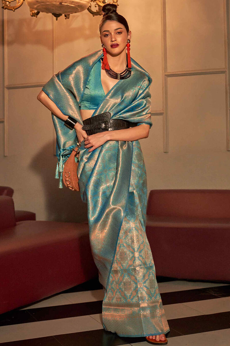 Unique Turquoise Kanjivaram Silk Saree With Cynosure Blouse Piece