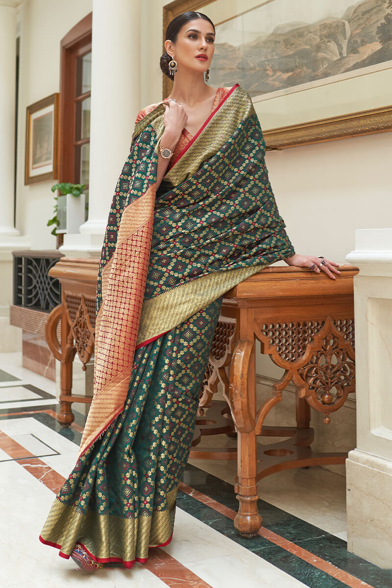 Demure Dark Green Soft Patola Silk Saree with Ethereal Blouse Piece