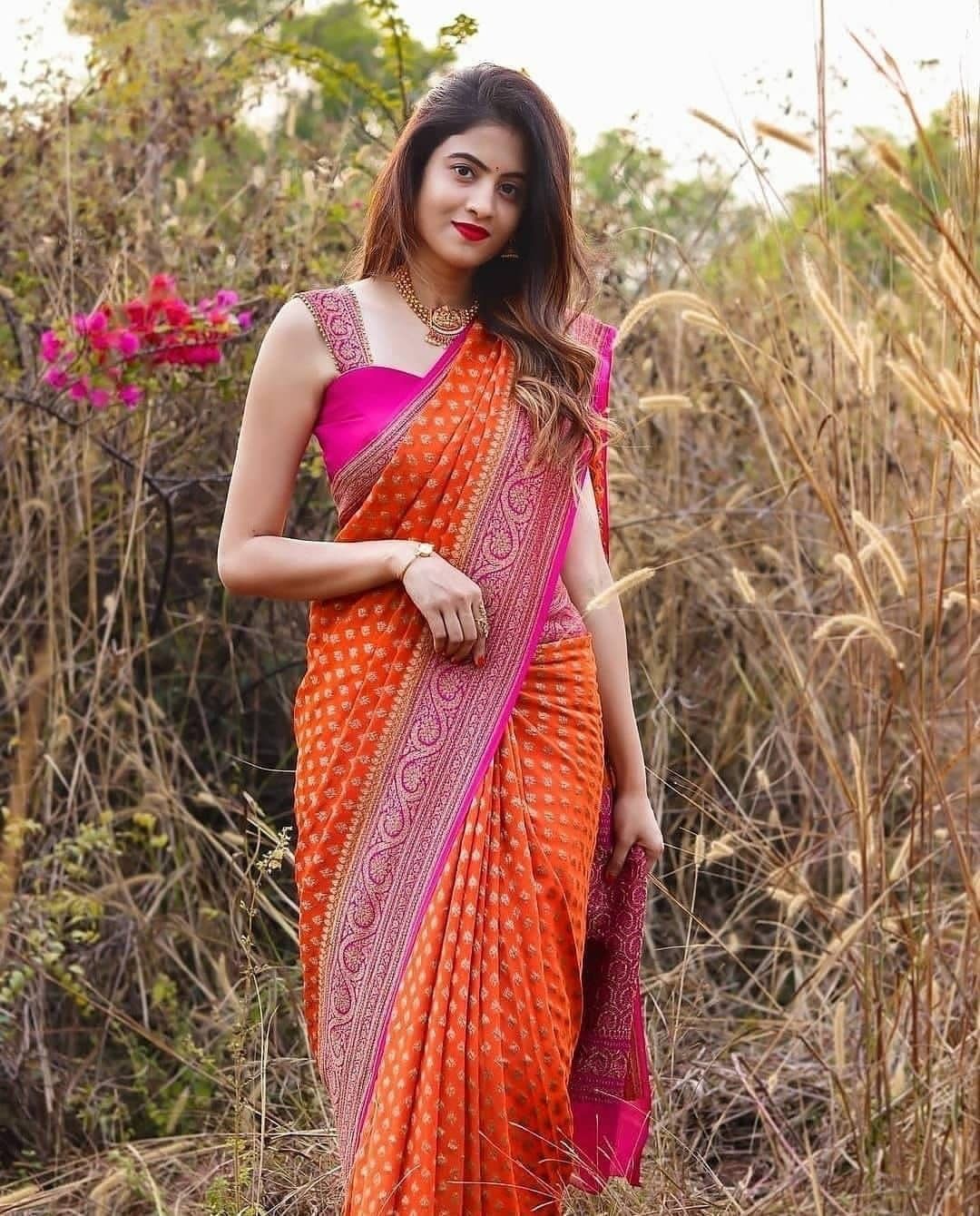 Appealing Orange Soft Banarasi Silk Saree With Twirling Blouse Piece