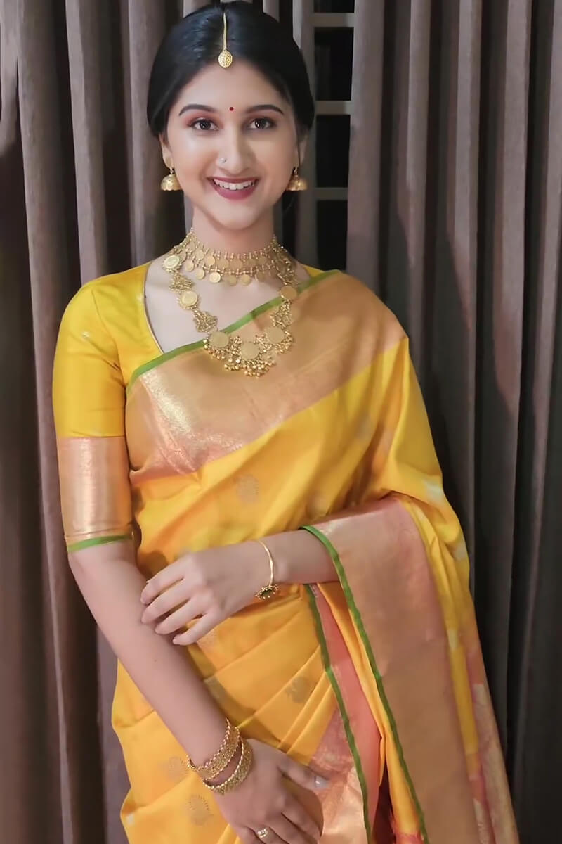 Devastating Yellow Soft Silk Saree With Mesmeric Blouse Piece