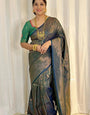 Enigmatic Dark Green Soft Silk Saree With Allure Blouse Piece