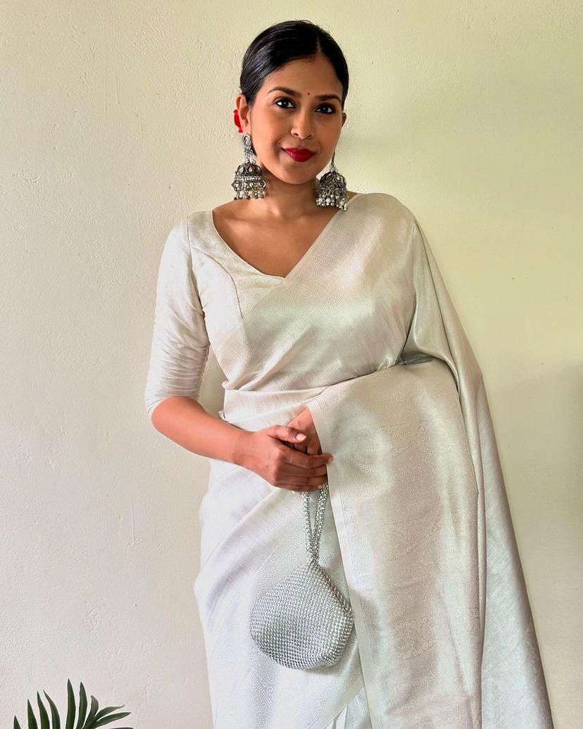 Dissemble Off White Kanjivaram Silk Saree With Radiant Blouse Piece
