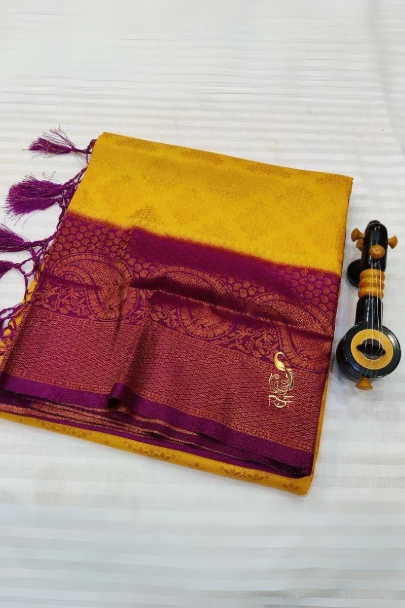 Cynosure Yellow Soft Banarasi Silk Saree With Moiety Blouse Piece