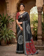 Opulent Black Printed Cotton Silk Saree With Unique Blouse Piece