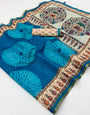 Pulsating Firozi Printed Cotton Silk Saree With Mesmerising Blouse Piece